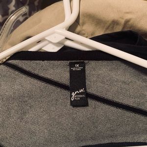 Grey and black sweater cut diagonally. Looks great with leggings.